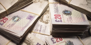 British Currency: Wads of twenty pound banknotes in pile, close-up